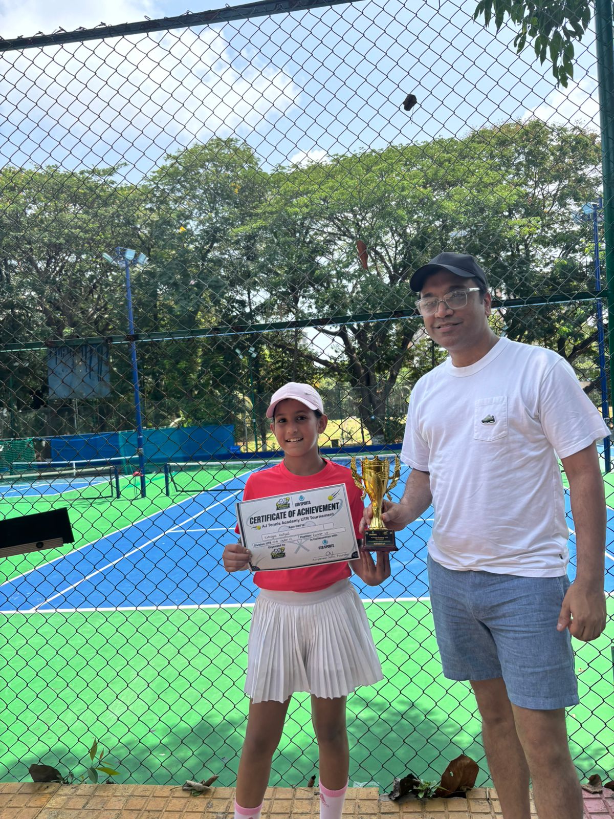 Young player with certificate of achievement
